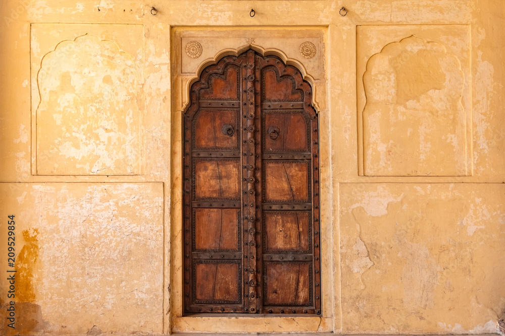 Fototapeta premium Antique rustic ancient wooden door. Architectural element.