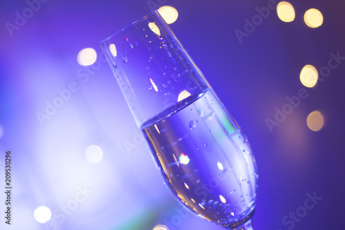 Champagne glass in disco party bar