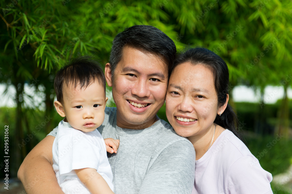 Young Asian Chinese family with baby son enjoying outdoor Young Asian Chinese family with baby son enjoying outdoor