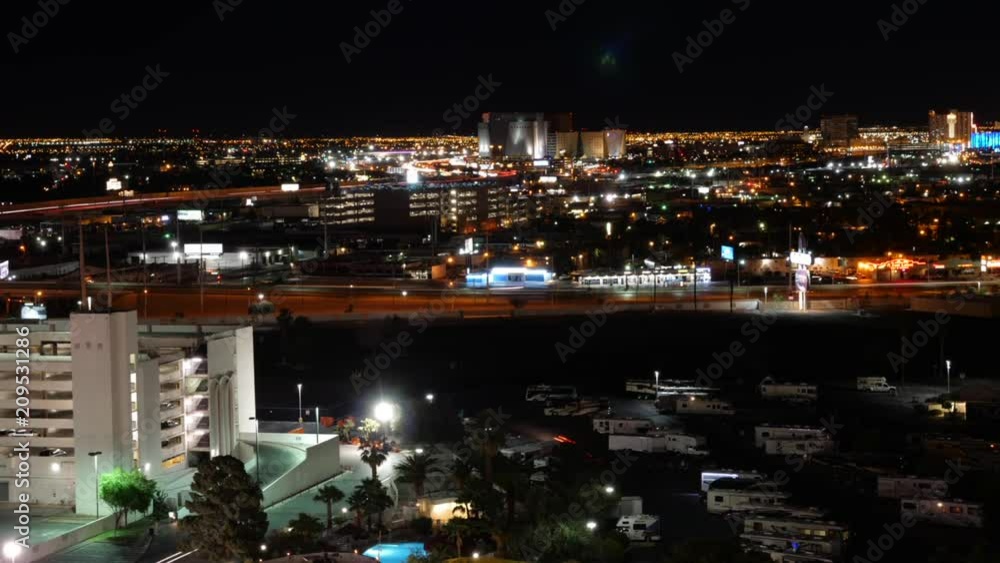 Timelapse of cars driving through city at night from above Timelapse of cars driving through city at night from above