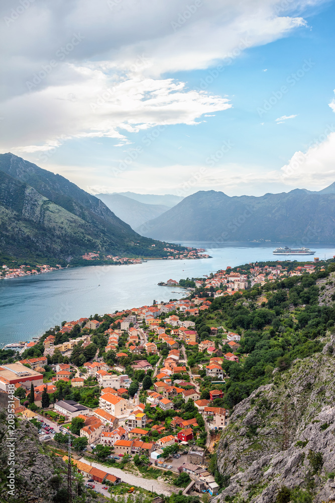 View from above on the old city Kotor, bay in Adriatic sea and mountains in Montenegro at sunset time, gorgeous nature landscape