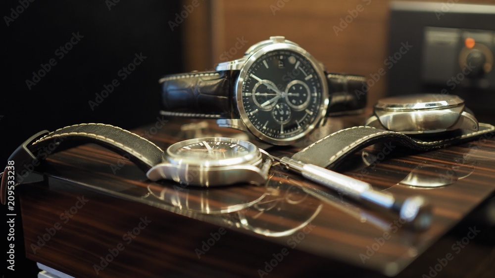 Closeup of luxury watches and tools.(Selected focus) Closeup of luxury watches and tools.(Selected focus)