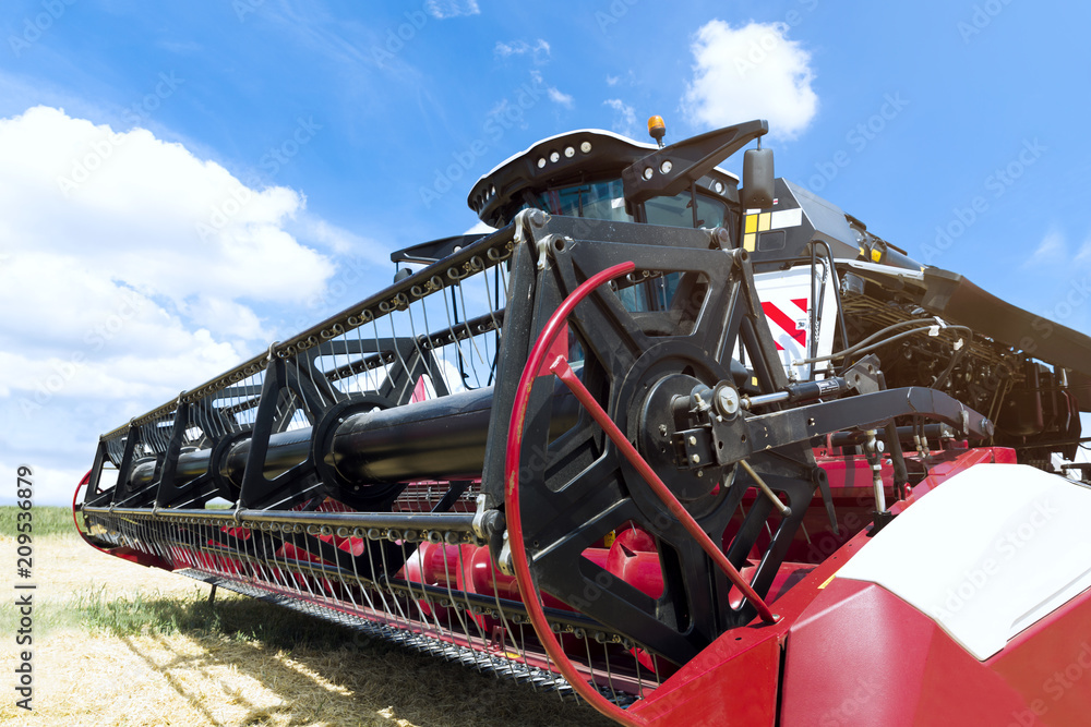 Fototapeta premium Combine harvester draper head. Agriculture heavy machinery