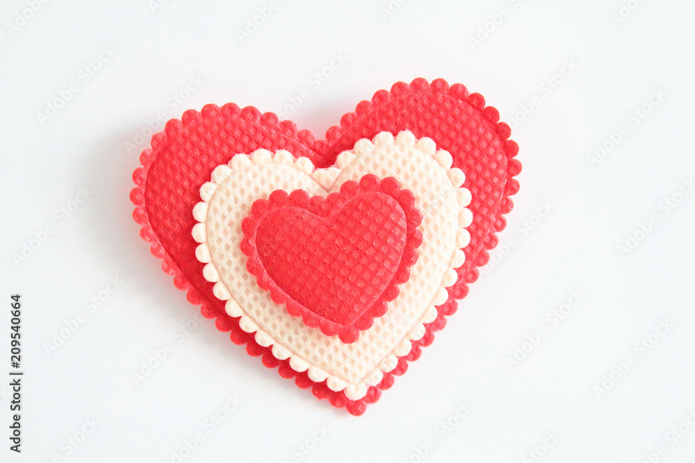 Beautiful heart made of fabric on a white background. Close-up. Background. Texture.