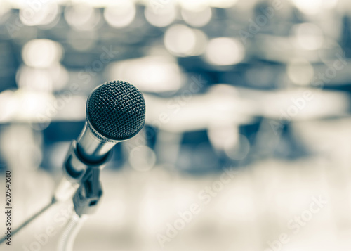 Microphone speaker for seminar or conference meeting in educational business event photo