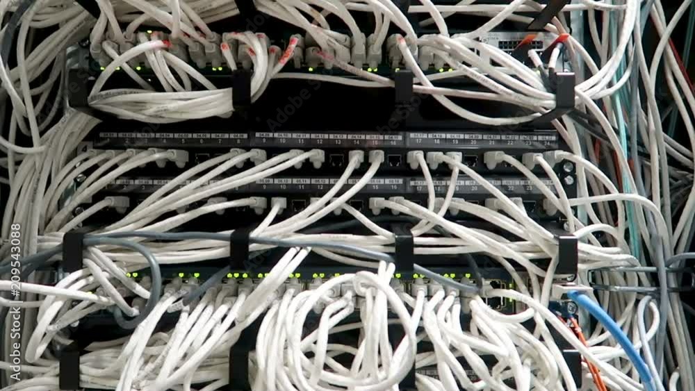 RG-45 Working Ethernet switch in data center room, connecting computers together. RG-45 Working Ethernet switch in data center room, connecting computers together.