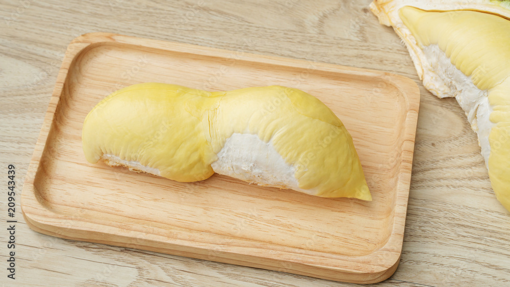 Ripe durian fruit on a wooden table. Ripe durian fruit on a wooden table.