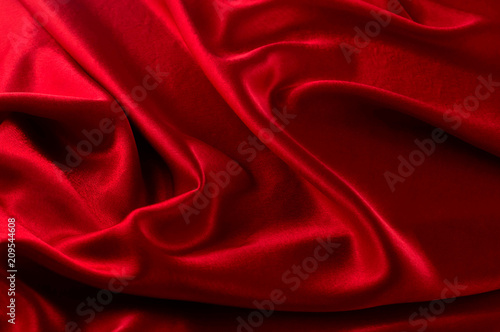 Abstract silk luxury background, piece of cloth, deep red cloth texture