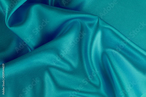 Abstract silk luxury background, piece of cloth, deep sea blue cloth texture