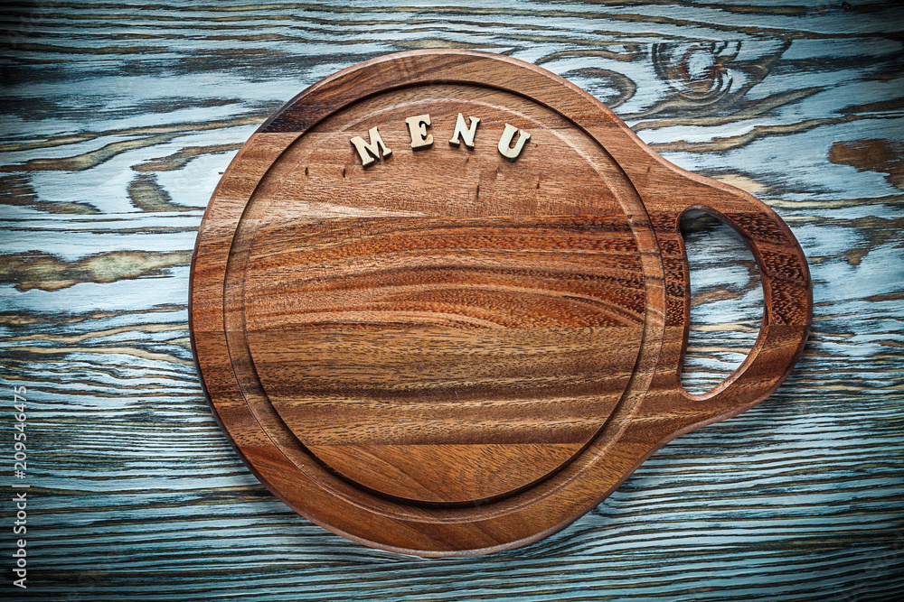 Carving board text on wooden surface Carving board text on wooden surface