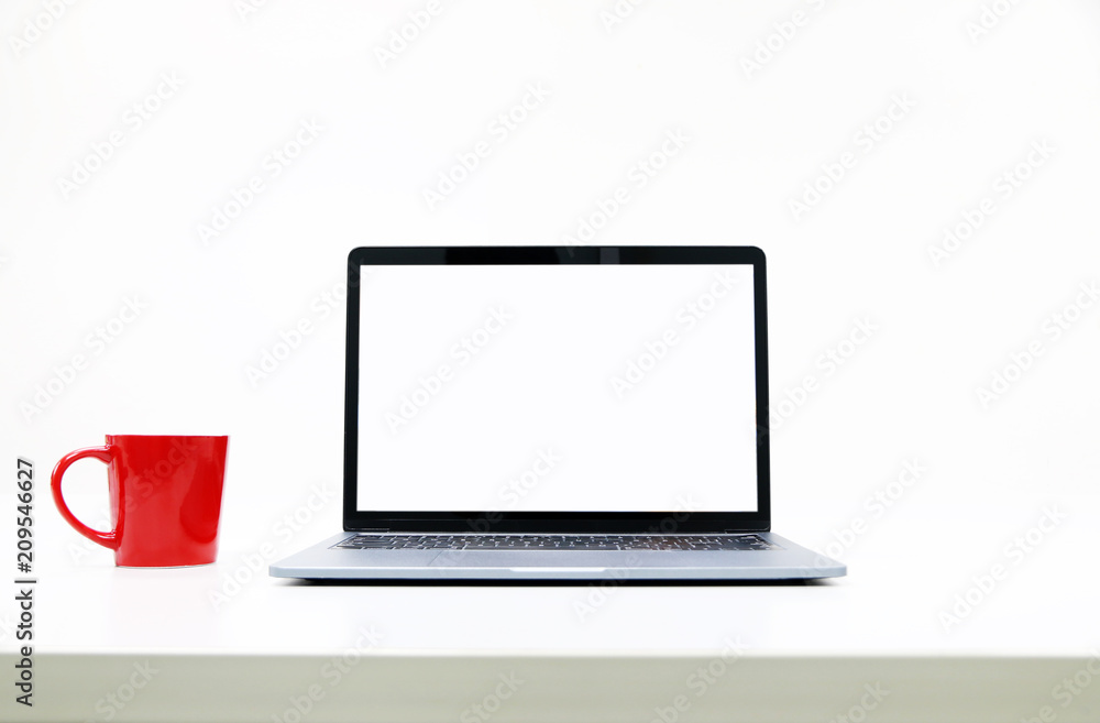 blank Screen Laptop and Red Coffee Cup in modern office blank Screen Laptop and Red Coffee Cup in modern office