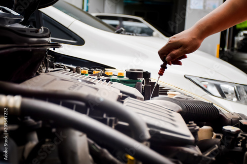 Man with checking car engine.