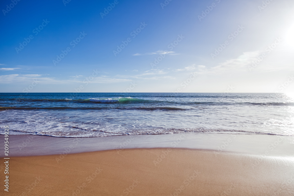 ocean coast, sand beach and foamy waves, beautiful natural vacation background and texture