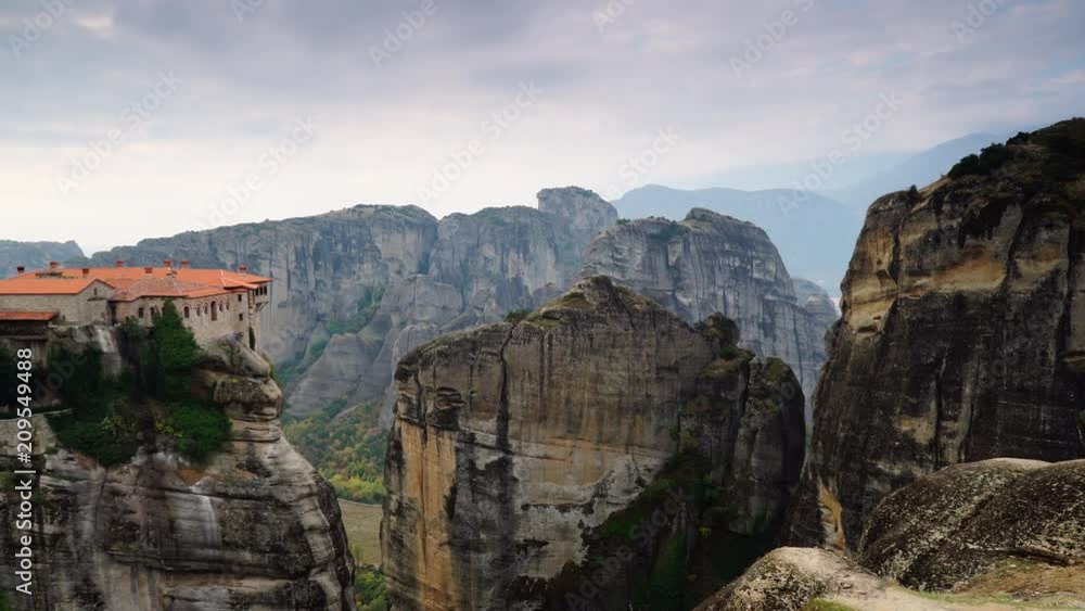 Overcast sky over holy Varlaam monastery on cliff in Meteora, Thessaly Greece. Greek destinations Overcast sky over holy Varlaam monastery on cliff in Meteora, Thessaly Greece. Greek destinations