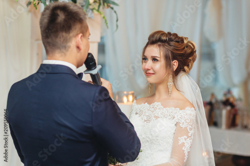 groom holding microphone and talking speech