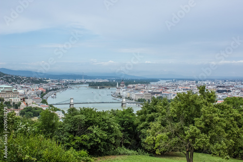 Budapest in rainy and fog day waterfront urban city district scape from above top of hill with mountain on horizon view 