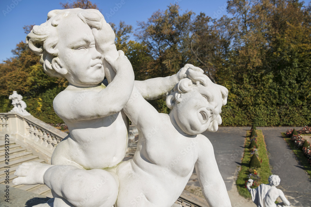 Fototapeta premium Beautiful palace Wilanow in Warsaw. Capital of Poland. Sculptures in garden.