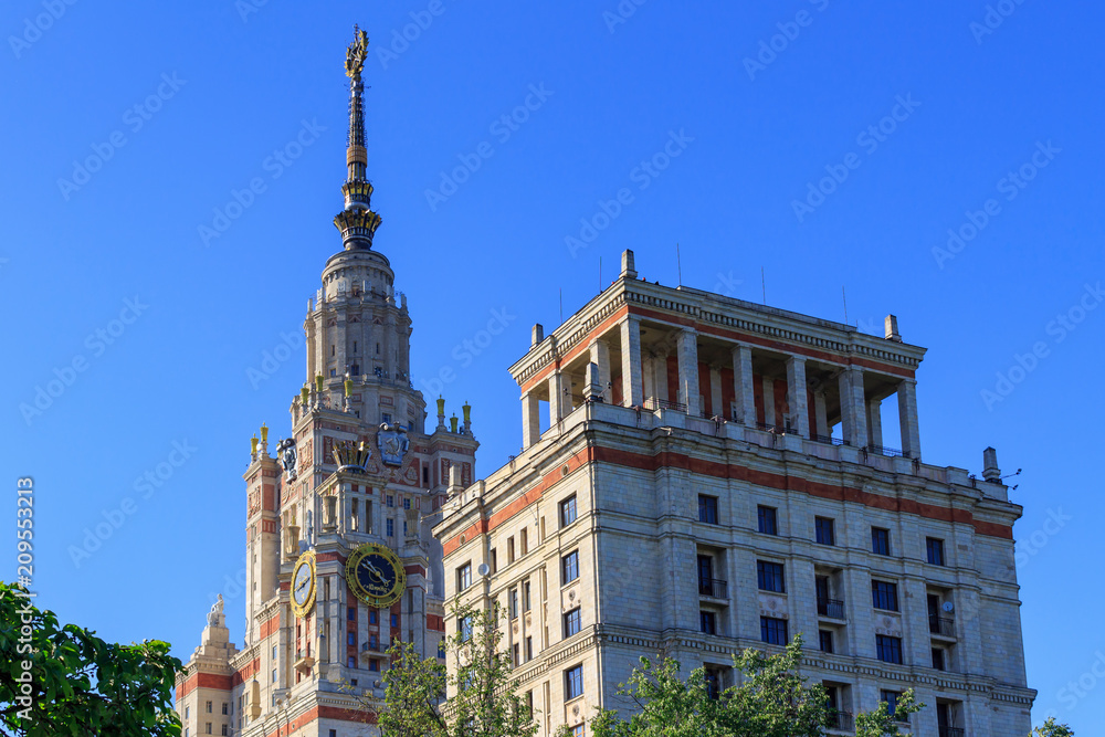 Towers of Lomonosov Moscow State University (MSU) on a blue sky background in sunny summer evening
