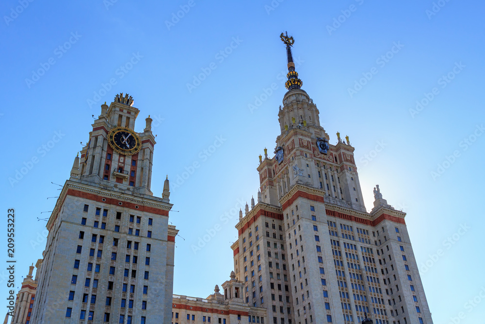 Towers of Lomonosov Moscow State University (MSU) on a blue sky background at summer evening Towers of Lomonosov Moscow State University (MSU) on a blue sky background at summer evening