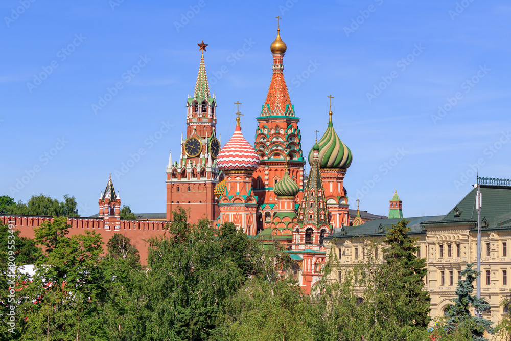 St. Basil's Cathedral with Moscow Kremlin on a blue sky background. View from Zaryadye Park