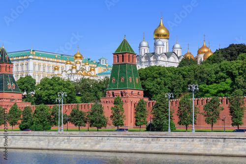 Buildings of churches on the territory of Moscow Kremlin against blue sky in sunny summer morning