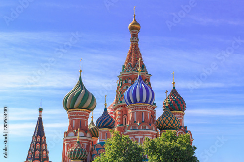 Domes of St. Basil's Cathedral on Red square on a blue sky background