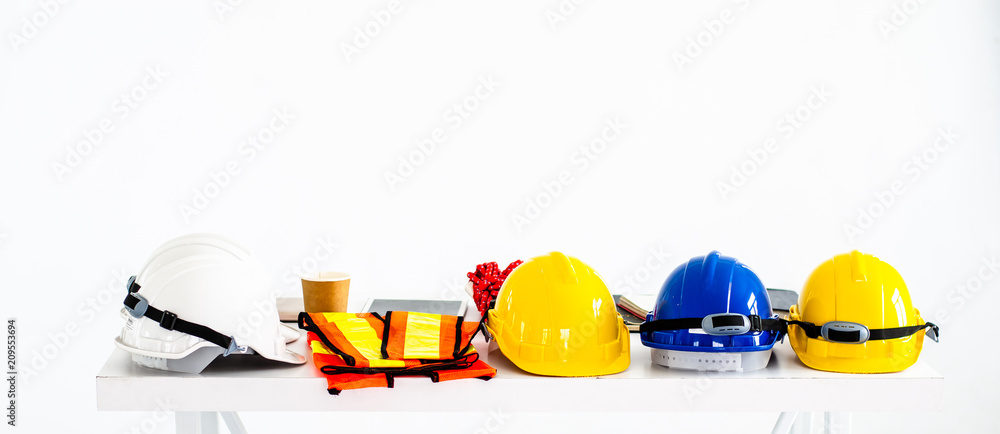 Safety helmet and equipment work of the engineers, construction on the white table. - obrazy, fototapety, plakaty 