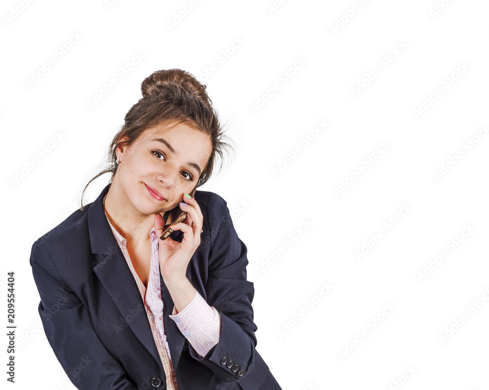Young flirting beautiful lady in official clotheslooking at the camera and talking on smartphone isolated Young flirting beautiful lady in official clotheslooking at the camera and talking on smartphone isolated