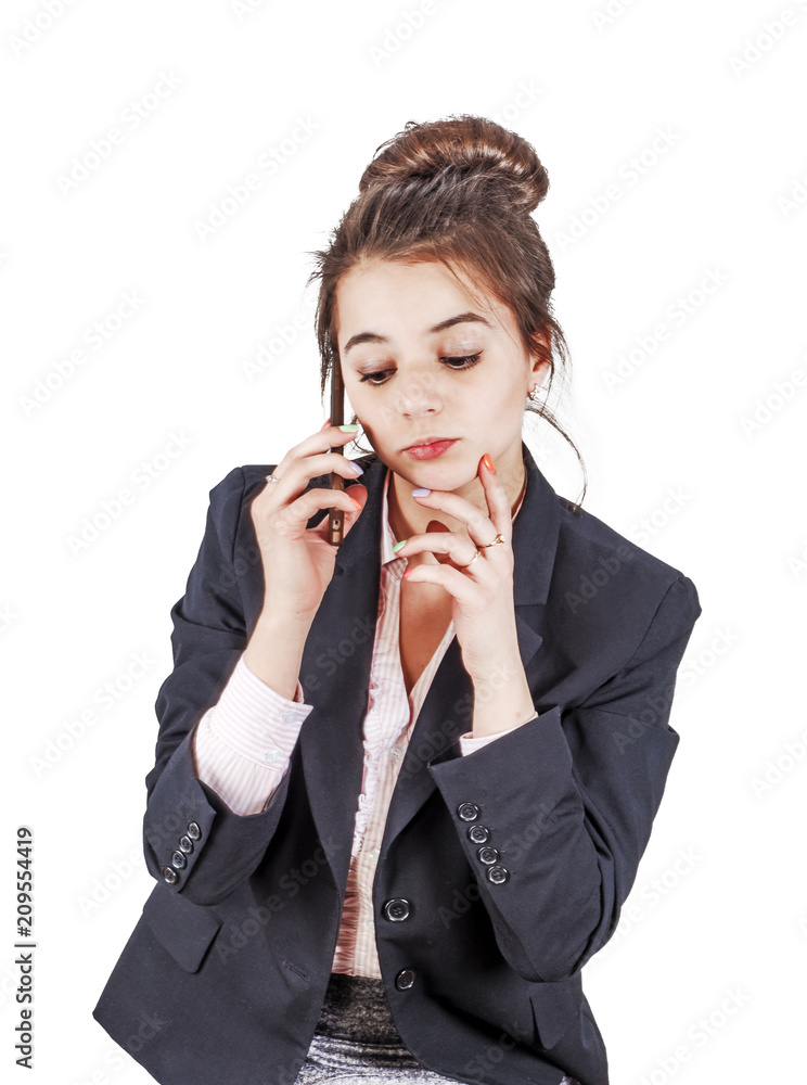 Young flirting beautiful lady in official clothes looking down and talking on smartphone isolated Young flirting beautiful lady in official clothes looking down and talking on smartphone isolated