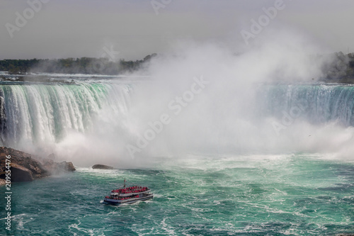 A boat sailing in Niagara Falls on Canadian side