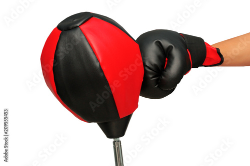 Right hand with black and red boxing grove punch to the upholstering black and red punching ball bag until the tilt.