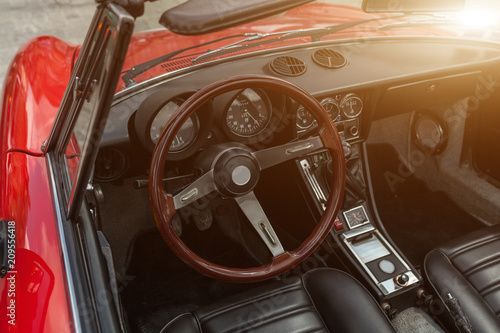 Retro style classic red car interior with matching dashboard © Andrii