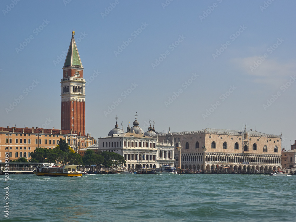 Campanile and Doges Palace in San Marco, Venice, Italy viewed over the lagoon from St Marks Basin in a scenic cityscape