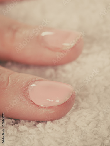 Woman presenting her beautiful painted gel hybrid nails