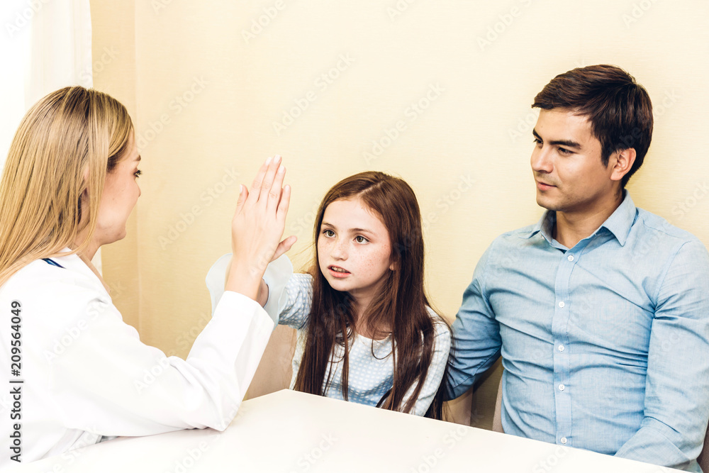 Doctor giving hi five with little girl patient in hospital.healthcare and medicine Doctor giving hi five with little girl patient in hospital.healthcare and medicine