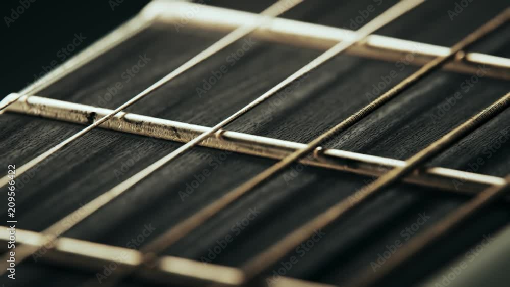 Fretboard details of six-string electric guitar. Worn out, rusty strings closeup Fretboard details of six-string electric guitar. Worn out, rusty strings closeup