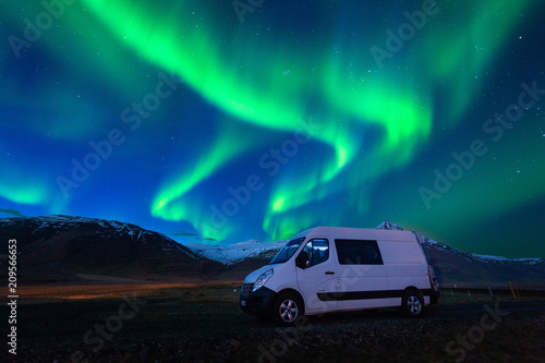 Northern lights  Aurora borealis  and car at night.