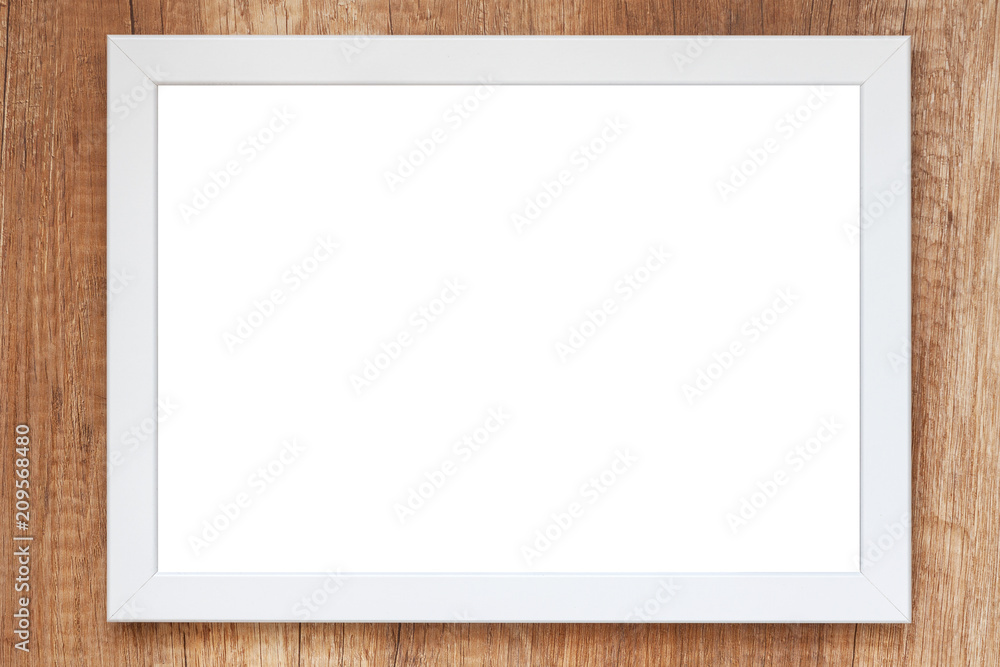 Wooden desk with white empty mockup frame Wooden desk with white empty mockup frame