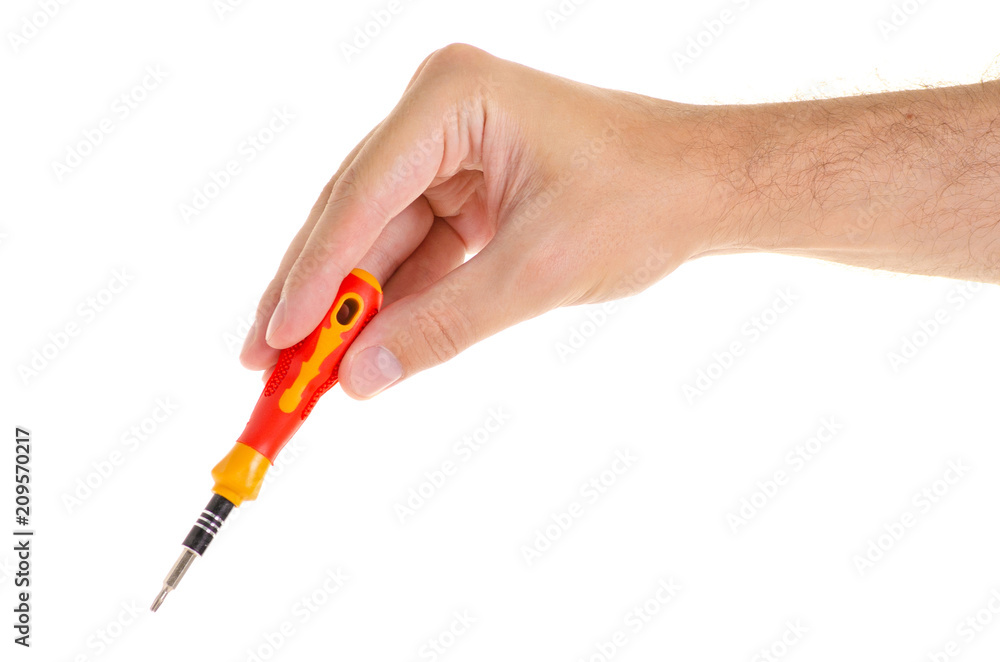 The screwdriver in hand on white background isolation The screwdriver in hand on white background isolation