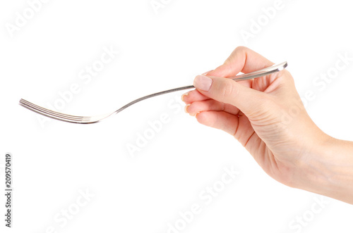 Fork in a hand on a white background isolation