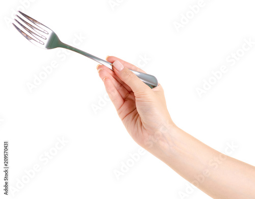 Fork in a hand on a white background isolation