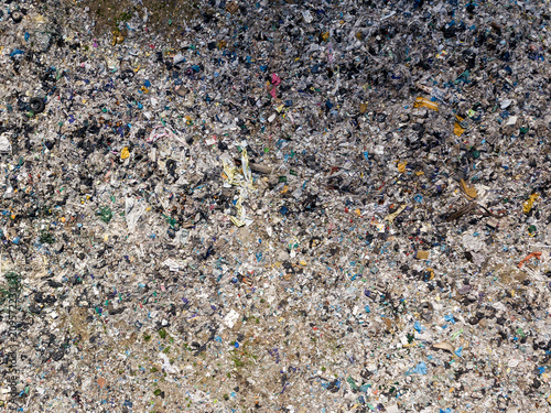 Environmental pollution. Aerial top view photo from flying drone of large garbage pile. Garbage pile in trash dump or landfill.