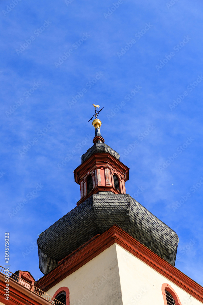 Typical german catholic church tower in front of blue sky in Nierstein, Rheinhessen Typical german catholic church tower in front of blue sky in Nierstein, Rheinhessen