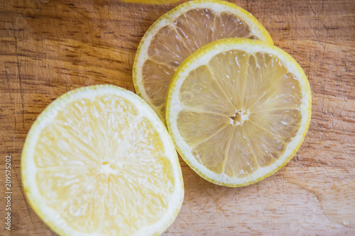 preparing fresh lemons with steel knife