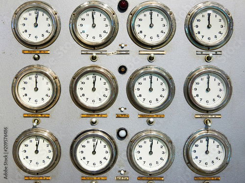 Retro clock faces on train control panel