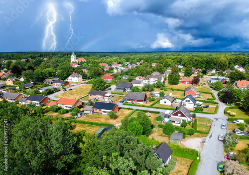 Aerial village view in stormy season