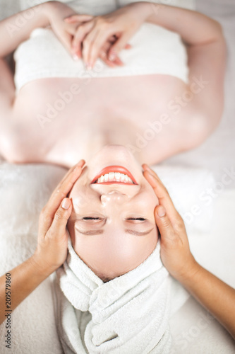 Papier peint Adult european wealthy woman getting anti-aging face-lifting massage relaxing after working day