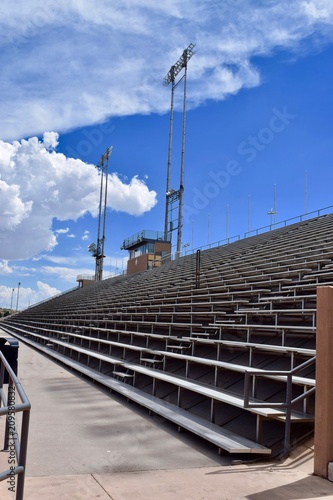 Stadium Bleachers with Blue Sky and Clouds