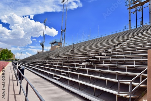 Stadium Bleachers with Blue Sky and Clouds