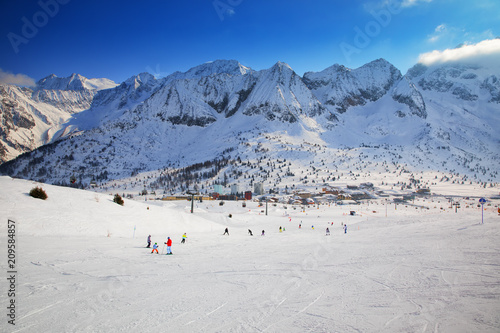 Stunning winter panorama in Tonale ski resort. View of Adamello, Presanella mountains from Tonale town, Italian Alps, Europe. photo